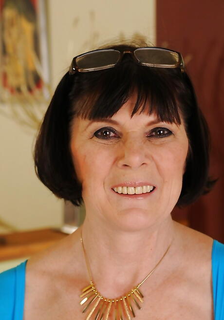 Stunning granny Margo T. in skirt uncovers small tits and spreads her legs 