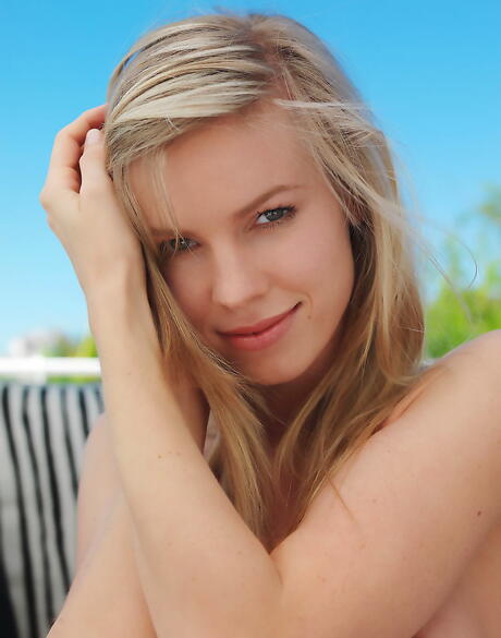 Slender blond youthful Marketa B exhibits big hooters and spreads her legs 